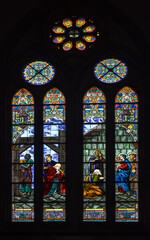 Fototapeta na wymiar Beautiful and Colorful stainglass light at catholic church.