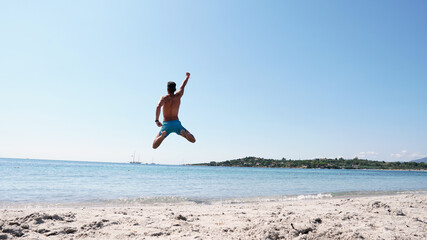 A guy jumping into the sea