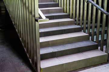 Modern concrete stairs with metal handrails
