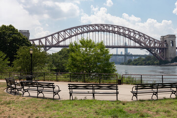 Astoria Queens Riverfront Park along the East River in New York City during Summer with the Hell Gate Bridge