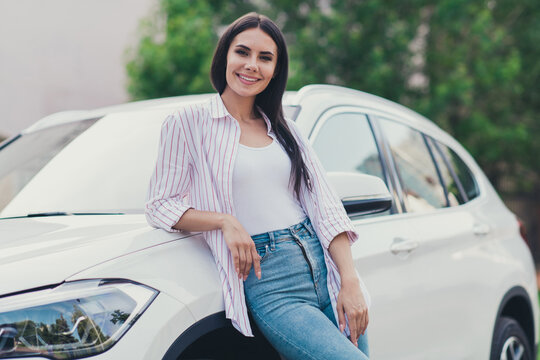 Photo Of Positive Cheerful Girl Stand Near White Luxury Car Enjoy Her New Sale Salon Purchase Ready For Summer Road Freedom Adventure In Town Center Outdoors