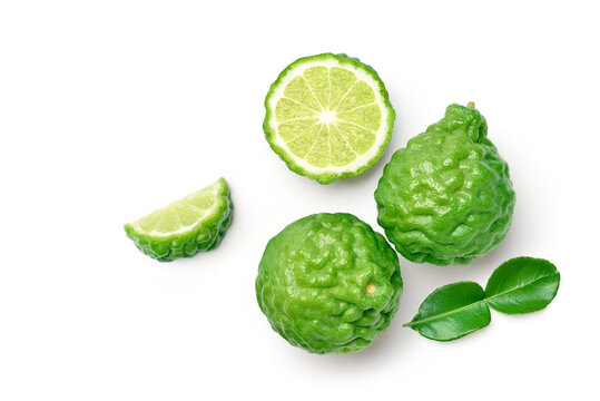 Flat lay (top view) of Bergamot fruit with cut in half and leaf isolated on white background.
