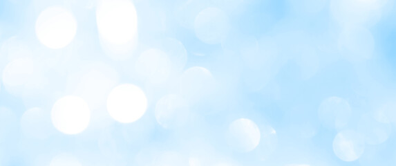 Bokeh light on blue background, sky with circle glitter light blue. Snow abstract soft glowing with vivid bright light and bokeh blur effect. 