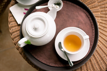 Tea pot and Tea cup on  wooden table