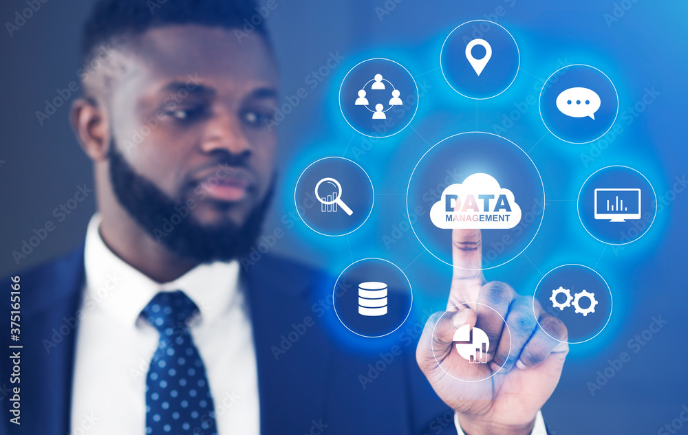 Poster Data Management. African Businessman Choosing Button On Digital Screen With Multimedia Buttons