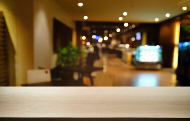 Empty dark wooden table in front of abstract blurred bokeh background of restaurant . can be used for display or montage your products.Mock up for space.