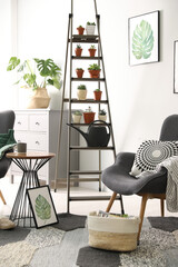 Stylish living room interior with decorative ladder