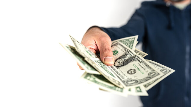 front view midsection of caucasian man offering or handing over money to someone else against white background