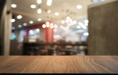 Empty dark wooden table in front of abstract blurred bokeh background of restaurant . can be used for display or montage your products.Mock up for space.