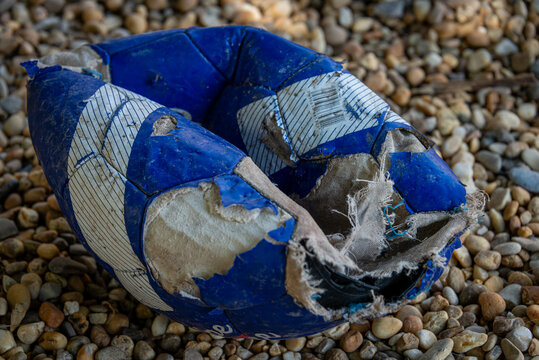 Football Chewed Up By Dog Showing Destructive Behaviour, Dog Toy.