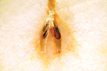 macro of halved juicy pear with seeds