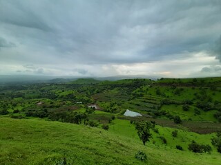Fototapeta na wymiar landscape with green fields and blue sky
