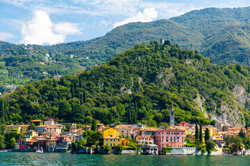 Fototapeta na wymiar Landscape with lake and mediterranean buildings, lake Como, Varenna, Lombardy region in Italy..