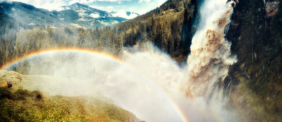 big waterfall with beautiful rainbow 