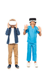 boy touching virtual reality headset while kid gesturing isolated on white