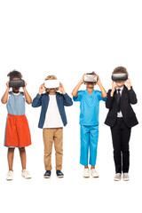 Obraz premium multicultural children dressed in costumes of different professions touching virtual reality headsets isolated on white