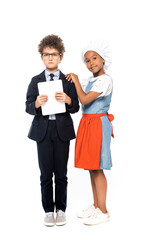 african american kid touching boy in glasses and suit holding digital tablet isolated on white