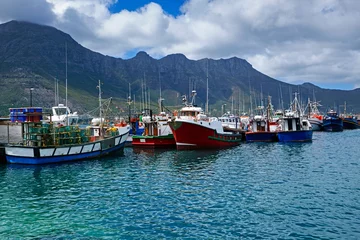 Fototapeten Moored fishing boots in the small fishing village of Hout Bay in Western Cape, South Africa © allan
