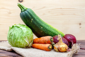 Still life of fresh and organic vegetables. Autumn harvest from the garden. Zucchini, cabbage, carrots and beets
