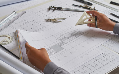 Architect engineer contractor design working drawing sketch plan blueprint and making architectural...