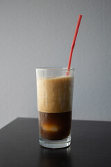 iced coffee with a red straw