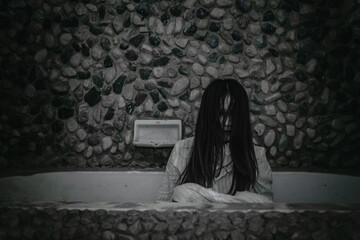 Portrait of asian woman make up ghost face with blood,Horror scene,Scary background,Halloween...