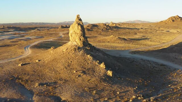 Aerial point of interest shot of a big rock formation of the Trona Pinnacles during the sunrise.