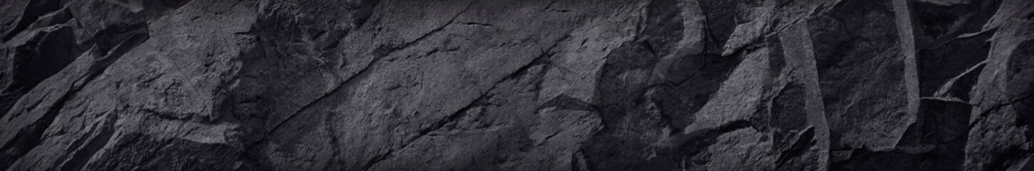 Long banner with stone texture. Black rock background. Website header.