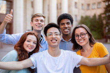 Cheerful Multicultural Students Posing Together Making Selfie Near University Building