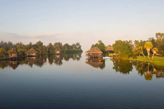 Laguna del Tesoro, Treasure Lagoon, Palm trees and wooden cabins, Zapata Peninsula, Cuba, Central America