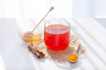 Turmeric tea with honey, cinnamon in the morning. Detox, healthy drink concept.