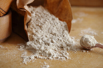 Almond flour pile from top on wooden background