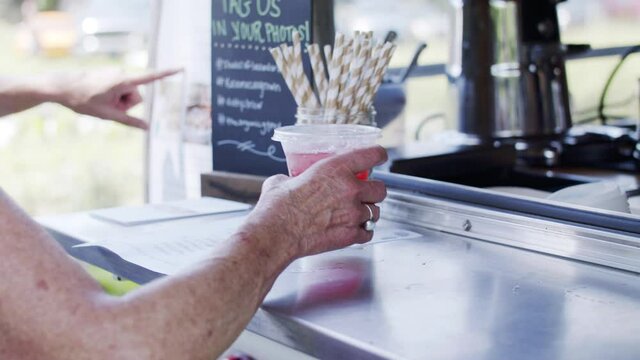 Ordering a drink at a food truck