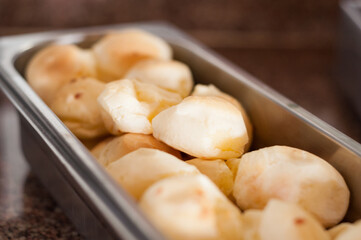 Breakfast table with a lot of food and focus on the first item