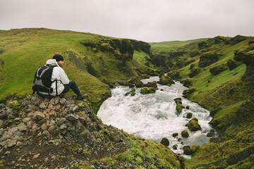 Hiker Having a Rest in a Viewpoint Over Skogar River