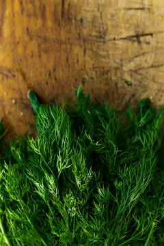 Fresh dill on wooden board
