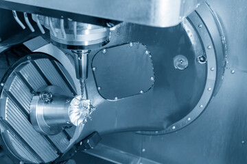 The  5 axis CNC milling machine cutting the turbine blade parts with solid ball end-mill tools. The hi-technology turbocharger part manufacturing process by 5 axis machining center. © Pixel_B