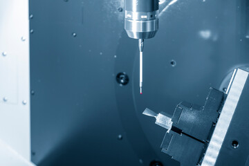 The CMM probe attache on the 5-axis CNC milling machine. The quality control of hi-precision parts with  touching probe on machining center.