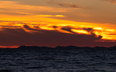 Fototapeta premium Colorful sunset at the Adriatic sea photographed in August 2020 in Zadar, Croatia