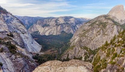 Half Dome (right) and Valley floor as seen from Taft Point at Yosemite National Park.