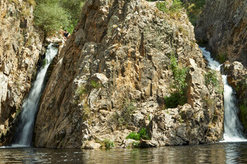 two waterfalls on the mountains