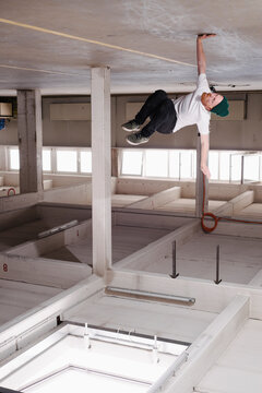 Break dancing man in industrial building