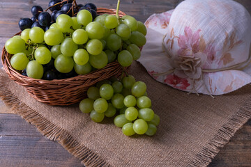 basket with grapes, ripe bunches of grape harvest