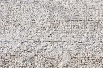 Plaster and brick texture.