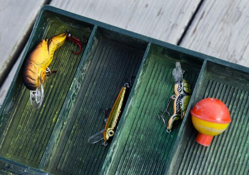 Tackle box with fishing lures and bobber