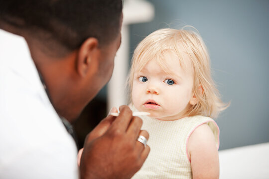 Pediatrician: Child Patient Unsure of Tongue Depressor