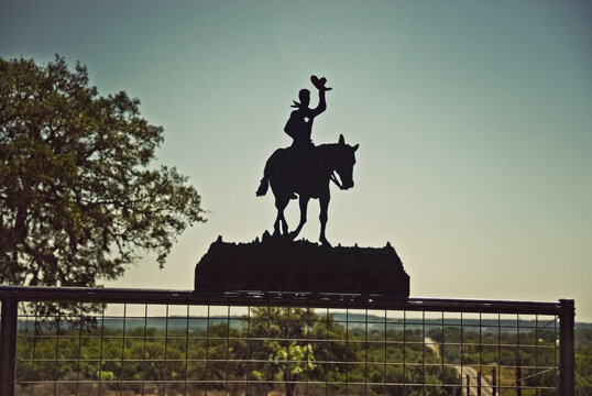 cowboy silhouette tipping hat Texas Hill Country