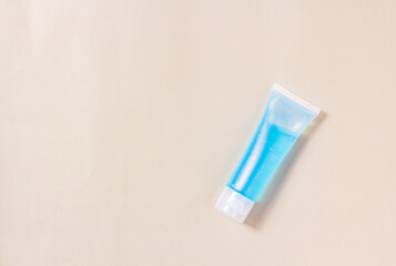 Flat lay blue alcohol gel tubes for prevention and disinfection of corona virus. Or hand wash in hospital or home for safety. Isolated style gray background and copy space for text.