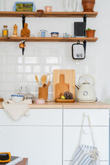 white kitchen interior. Scandinavian interior design in light colors with plants and accessories.