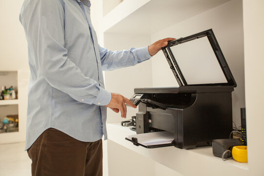 Anonymous Man Using Printer